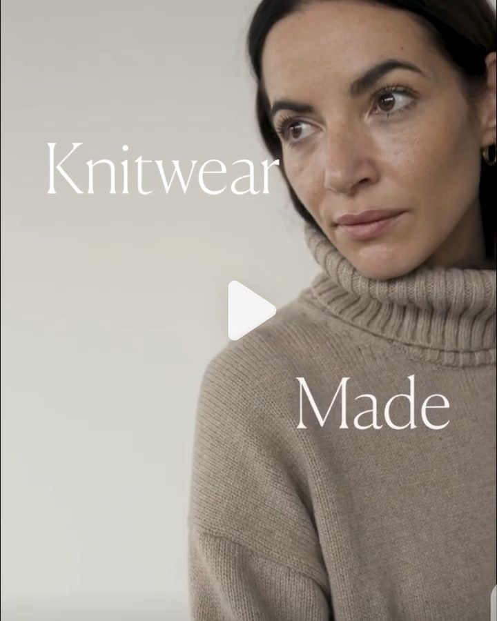 Woman in a taupe ribbed turtleneck looking off frame against a pale wall